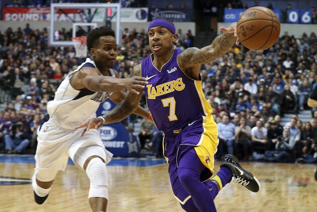Los Angeles Lakers guard Isaiah Thomas (7) loses the ball as he drives to the basket against Dallas Mavericks guard Yogi Ferrell (11) during an NBA basketball game in Dallas, Saturday, Feb. 10, 2018. (AP Photo/ Richard W. Rodriguez)