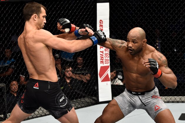 PERTH, AUSTRALIA - FEBRUARY 11:  (R-L) Yoel Romero of Cuba punches Luke Rockhold in their interim middleweight title bout during the UFC 221 event at Perth Arena on February 11, 2018 in Perth, Australia. (Photo by Jeff Bottari/Zuffa LLC/Zuffa LLC via Getty Images)