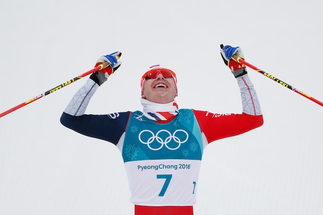 Norway's Simen Hegstad Krueger crosses the finish line to win gold in the men's 15km + 15km cross-country skiathlon at the Alpensia cross country ski centre during the Pyeongchang 2018 Winter Olympic Games on February 11, 2018 in Pyeongchang.  / AFP PHOTO / Odd ANDERSEN        (Photo credit should read ODD ANDERSEN/AFP/Getty Images)