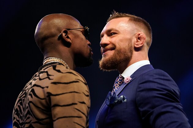 LONDON, ENGLAND - JULY 14:  (R-L) Conor McGregor and Floyd Mayweather Jr. face off during the Floyd Mayweather Jr. v Conor McGregor World Press Tour event at SSE Arena on July 14, 2017 in London, England. (Photo by Jeff Bottari/Zuffa LLC/Zuffa LLC via Getty Images)