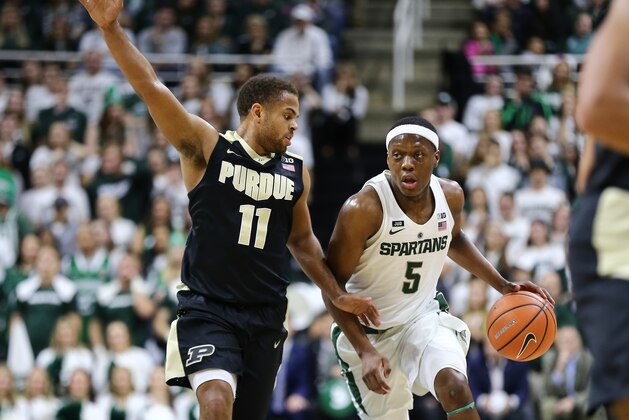 EAST LANSING, MI - FEBRUARY 10: Cassius Winston #5 of the Michigan State Spartans handles the ball while defended by  P.J. Thompson #11 of the Purdue Boilermakers at Breslin Center on February 10, 2018 in East Lansing, Michigan. (Photo by Rey Del Rio/Getty Images)