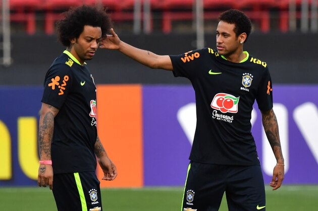 Brazil's team player Neymar (R) jokes with Marcelo (L) during a training session at the Morumbi stadium in Sao Paulo, Brazil on March 25, 2017 ahead of a 2018 FIFA World Cup qualifier match against Paraguay on March 28 in Sao Paulo, Brazil. / AFP PHOTO / NELSON ALMEIDA        (Photo credit should read NELSON ALMEIDA/AFP/Getty Images)