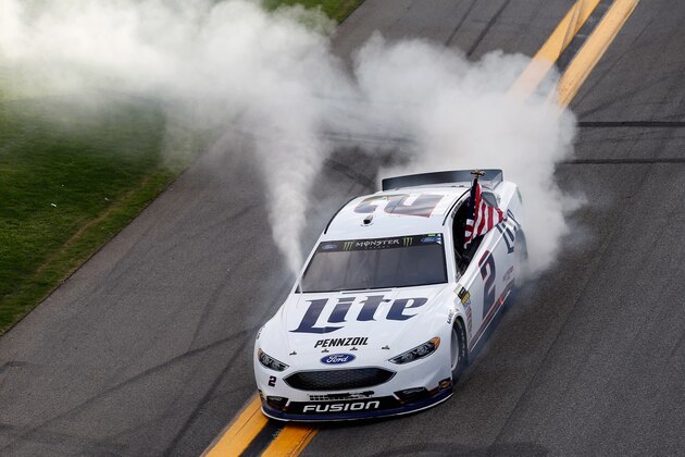 DAYTONA BEACH, FL - FEBRUARY 11:  Brad Keselowski, driver of the #2 Miller Lite Ford, celebrates with a burnout after winning the Monster Energy NASCAR Cup Series Advance Auto Parts Clash at Daytona International Speedway on February 11, 2018 in Daytona Beach, Florida.  (Photo by Brian Lawdermilk/Getty Images)
