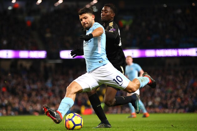 MANCHESTER, ENGLAND - FEBRUARY 10:  Sergio Aguero of Manchester City crosses the ball under pressure from Wilfred Ndidi of Leicester City during the Premier League match between Manchester City and Leicester City at Etihad Stadium on February 10, 2018 in Manchester, England.  (Photo by Clive Brunskill/Getty Images)