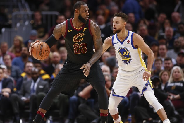 CLEVELAND, OH - JANUARY 15: LeBron James #23 of the Cleveland Cavaliers dribbles the ball against Stephen Curry #30 of the Golden State Warriors at Quicken Loans Arena on January 15, 2018 in Cleveland, Ohio. NOTE TO USER: User expressly acknowledges and agrees that, by downloading and or using this photograph, User is consenting to the terms and conditions of the Getty Images License Agreement.(Photo by Michael Hickey/Getty Images)