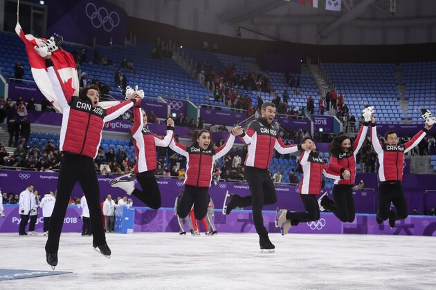 The Canadian team pose for a group photo following the Venue Ceremony after winning the gold medal in the figure skating team event in the Gangneung Ice Arena at the 2018 Winter Olympics in Gangneung, South Korea, Monday, Feb. 12, 2018. (AP Photo/Julie Jacobson)
