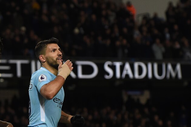 Manchester City's Argentinian striker Sergio Aguero celebrates after scoring their fourth goal, his third during the English Premier League football match between Manchester City and Leicester City at the Etihad Stadium in Manchester, north west England, on February 10, 2018. / AFP PHOTO / PAUL ELLIS / RESTRICTED TO EDITORIAL USE. No use with unauthorized audio, video, data, fixture lists, club/league logos or 'live' services. Online in-match use limited to 75 images, no video emulation. No use in betting, games or single club/league/player publications.  /         (Photo credit should read PAUL ELLIS/AFP/Getty Images)