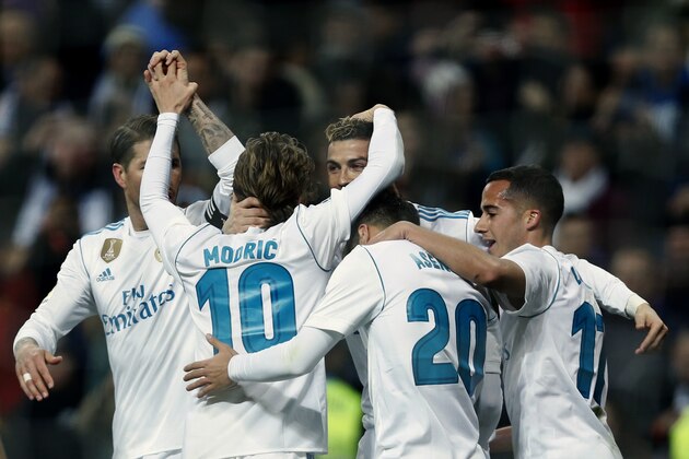 Real Madrid's Cristiano Ronaldo, centre, celebrates with teammates a goal against Real Sociedad during a Spanish La Liga soccer match between Real Madrid and Real Sociedad at the Santiago Bernabeu stadium in Madrid, Saturday, Feb. 10, 2018. Ronaldo scored a hat-trick in Real Madrid's 5-2 victory. (AP Photo/Francisco Seco)