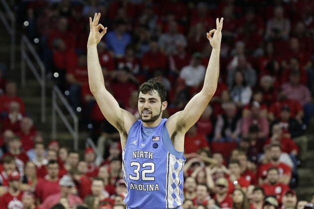 North Carolina's Luke Maye (32) reacts following a three-point basket against North Carolina State during the second half of an NCAA college basketball game in Raleigh, N.C., Saturday, Feb. 10, 2018. North Carolina won 96-89. (AP Photo/Gerry Broome)