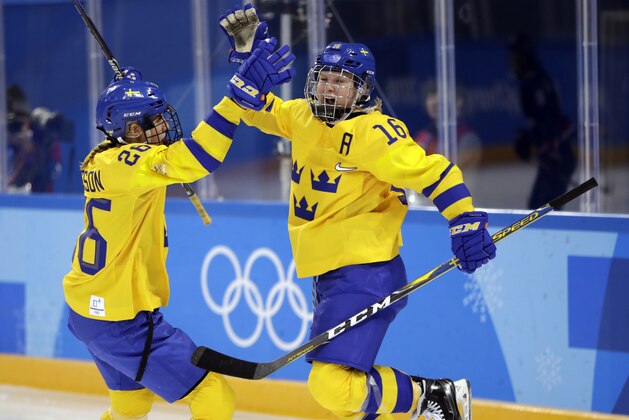 Pernilla Winberg (16) celebrates with Hanna Olsson (26), of Sweden, after scoring a goal against the combined Koreas during the second period of the preliminary round of the women's hockey game at the 2018 Winter Olympics in Gangneung, South Korea, Monday, Feb. 12, 2018. (AP Photo/Julio Cortez)