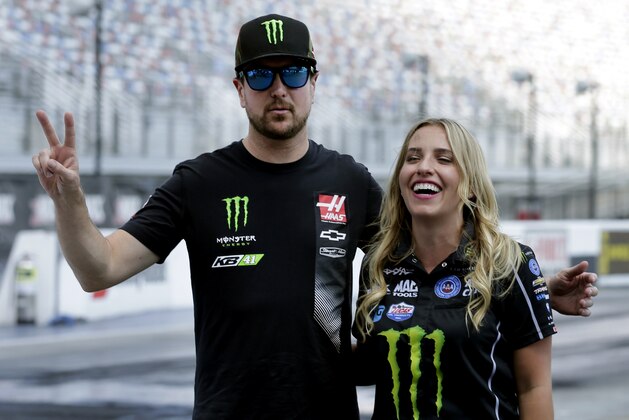 NASCAR driver Kurt Busch, left, jokes with NHRA drag racer Brittany Force, right, after beating her in a best of three drag race competition at Charlotte Motor Speedway's ZMax Dragway in Concord, N.C., during a news conference Wednesday, Sept. 7, 2016. The drivers raced identical Chevrolet Camaros before Busch drove Force around the oval race track. (AP Photo/Chuck Burton) NASCAR driver Kurt Busch, left, jokes with NHRA drag racer Brittany Force, right, after beating her in a best of three drag race competition at Charlotte Motor Speedway's ZMax Dragway in Concord, N.C., during a news conference Wednesday, Sept. 7, 2016. The drivers raced identical Chevrolet Camaros before Busch drove Force around the oval race track. (AP Photo/Chuck Burton)