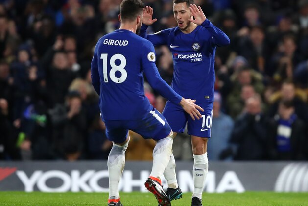 LONDON, ENGLAND - FEBRUARY 12: Eden Hazard of Chelsea celebrates after scoring his sides first goal with Olivier Giroud of Chelsea during the Premier League match between Chelsea and West Bromwich Albion at Stamford Bridge on February 12, 2018 in London, England.  (Photo by Julian Finney/Getty Images)