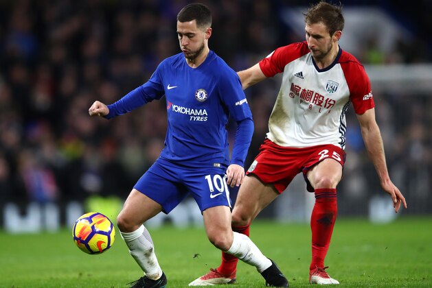 LONDON, ENGLAND - FEBRUARY 12:  Eden Hazard of Chelsea is challenged by Craig Dawson of West Bromwich Albion during the Premier League match between Chelsea and West Bromwich Albion at Stamford Bridge on February 12, 2018 in London, England.  (Photo by Julian Finney/Getty Images)