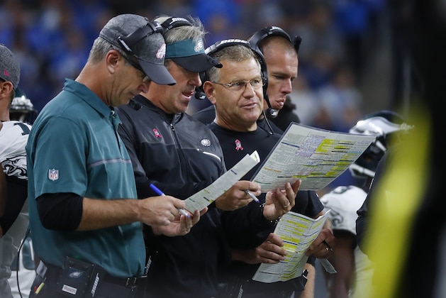 Philadelphia Eagles offensive coordinator, Frank Reich, from left, head coach Doug Pederson, offensive line coach Jeff Stoutland and tight ends coach Justin Peelle talk against the Detroit Lions during an NFL football game in Detroit, Sunday, Oct. 9, 2016. Detroit beat Philadelphia 24-23. (AP Photo/Paul Sancya)