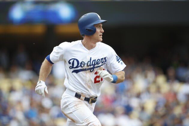 Los Angeles Dodgers' Chase Utley watches his solo home run during the fifth inning of a baseball game against the Cincinnati Reds, Sunday, June 11, 2017, in Los Angeles. (AP Photo/Ryan Kang)