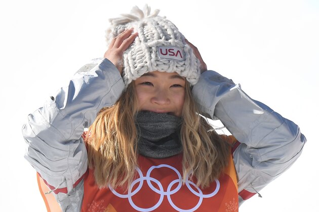Gold medallist US Chloe Kim celebrates during the victory ceremony after the women's snowboard halfpipe final event at the Phoenix Park during the Pyeongchang 2018 Winter Olympic Games on February 13, 2018 in Pyeongchang. / AFP PHOTO / LOIC VENANCE        (Photo credit should read LOIC VENANCE/AFP/Getty Images)