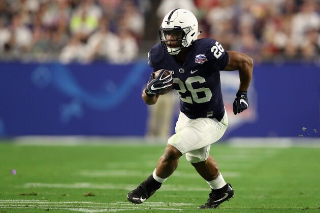 GLENDALE, AZ - DECEMBER 30:  Running back Saquon Barkley #26 of the Penn State Nittany Lions rushes the football against the Washington Huskies during the second half of the Playstation Fiesta Bowl at University of Phoenix Stadium on December 30, 2017 in Glendale, Arizona. The Nittany Lions defeated the Huskies 35-28.  (Photo by Christian Petersen/Getty Images)