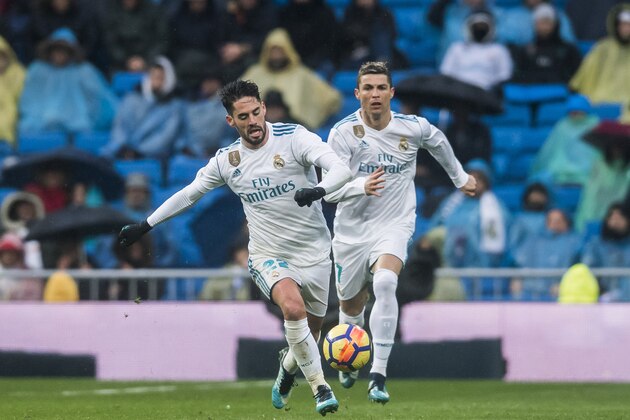 MADRID, SPAIN - JANUARY 13: Isco Alarcon and Cristiano Ronaldo of Real Madrid run for the ball during the La Liga 2017-18 match between Real Madrid and Villarreal CF at Santiago Bernabeu Stadium on January 13 2018 in Madrid, Spain. (Photo by Power Sport Images/Getty Images)