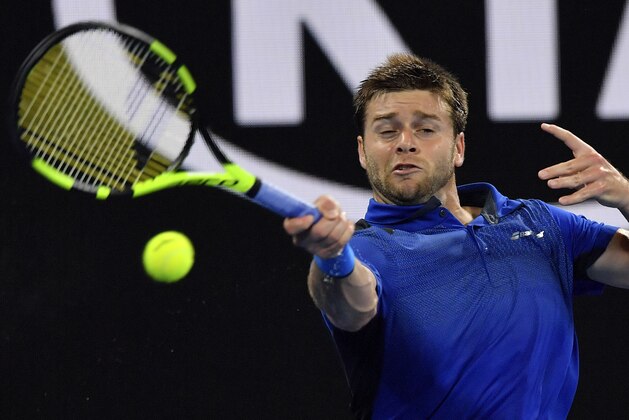 United States' Ryan Harrison hits a forehand return to Croatia's Marin Cilic during their third round match at the Australian Open tennis championships in Melbourne, Australia, Friday, Jan. 19, 2018. (AP Photo/Andy Brownbill)