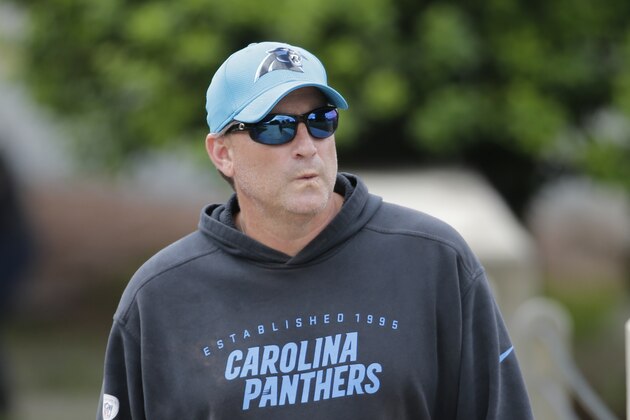 Carolina Panthers' offensive coordinator Mike Shula walks to practice during the NFL football team's rookie camp in Charlotte, N.C., Friday, May 5, 2017. (AP Photo/Chuck Burton)
