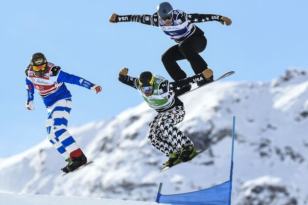 Austria's Alessandro Haemmerle (L), France's Pierre Vaultier (C) and Norway's Ruud Myhre (R) competes in the FIS Snowboard Cross Women World Cup on December 13, 2017 in Val Thorens, in the French Alps.   / AFP PHOTO / PHILIPPE DESMAZES        (Photo credit should read PHILIPPE DESMAZES/AFP/Getty Images)