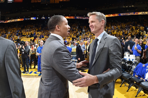 OAKLAND, CA - JUNE 2:  Head Coach Tyronn Lue  of the Cleveland Cavaliers exchange greetings with Head Coach Steve Kerr of the Golden State Warriors during Game One of the 2016 NBA Finals on June 2, 2016 at ORACLE Arena in Oakland, California. NOTE TO USER: User expressly acknowledges and agrees that, by downloading and or using this photograph, User is consenting to the terms and conditions of the Getty Images License Agreement. Mandatory Copyright Notice: Copyright 2016 NBAE (Photo by Andrew D. Bernstein/NBAE via Getty Images)