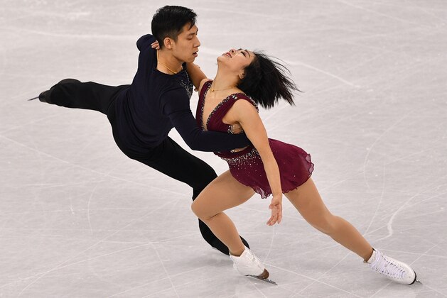 China's Sui Wenjing and China's Han Cong compete in the pair skating short program of the figure skating event during the Pyeongchang 2018 Winter Olympic Games at the Gangneung Ice Arena in Gangneung on February 14, 2018. / AFP PHOTO / Mladen ANTONOV        (Photo credit should read MLADEN ANTONOV/AFP/Getty Images)