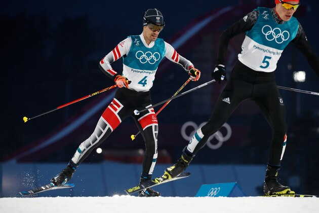 Austria's Lukas Klapfer (L) and Germany's Eric Frenzel compete in the nordic combined men's individual normal hill NH/10km cross country at the Alpensia cross country centre during the Pyeongchang 2018 Winter Olympic Games on February 14 , 2018 in Pyeongchang.  / AFP PHOTO / Odd ANDERSEN        (Photo credit should read ODD ANDERSEN/AFP/Getty Images)