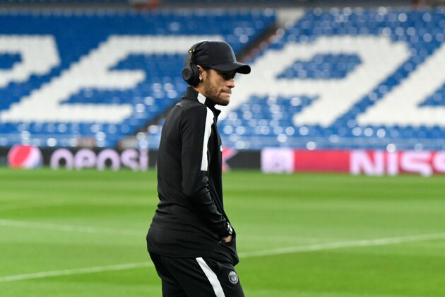 Paris Saint-Germain's Brazilian forward Neymar walks on the pitch at the Santiago Bernabeu stadium in Madrid on February 13, 2018 on the eve of their Champions' League football match against Real Madrid CF. / AFP PHOTO / CHRISTOPHE SIMON        (Photo credit should read CHRISTOPHE SIMON/AFP/Getty Images)