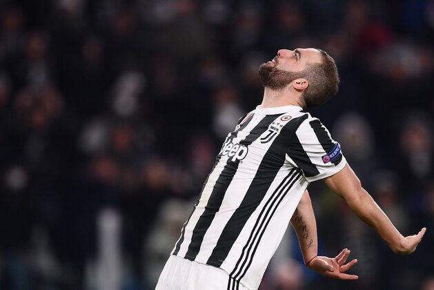 Juventus' forward from Argentina Gonzalo Higuain reacts during the UEFA Champions League round of sixteen first leg football match between Juventus and Tottenham Hotspur at The Allianz Stadium in Turin on February 13, 2018.  / AFP PHOTO / Marco BERTORELLO        (Photo credit should read MARCO BERTORELLO/AFP/Getty Images)