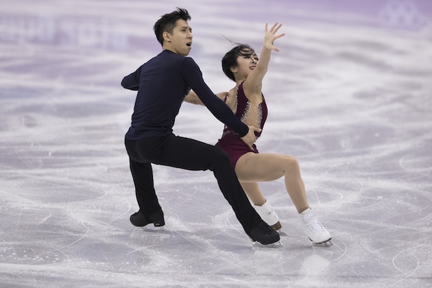 GANGNEUNG, SOUTH KOREA - FEBRUARY 14:  Wenjing Sui and Cong Han of China compete during the Pair Skating Short Program on day five of the PyeongChang 2018 Winter Olympics at Gangneung Ice Arena on February 14, 2018 in Gangneung, South Korea.  (Photo by XIN LI/Getty Images)