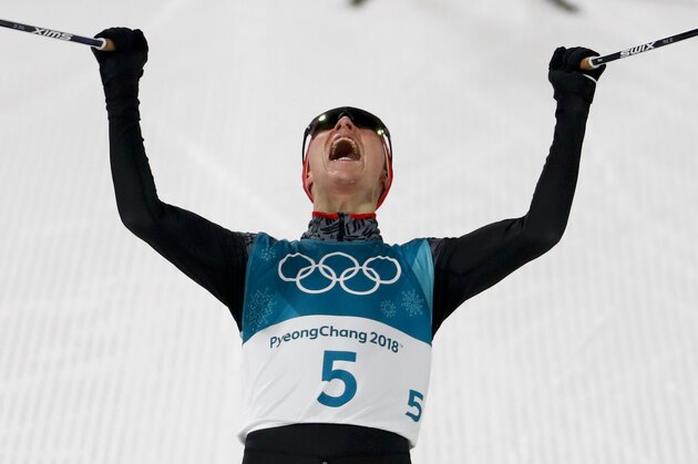 Eric Frenzel, of Germany, celebrates after winning the the gold medal after the 10km cross-country skiing portion of the nordic combined event at the 2018 Winter Olympics in Pyeongchang, South Korea, Wednesday, Feb. 14, 2018. (AP Photo/Matthias Schrader)