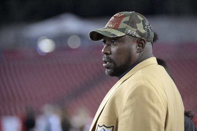 Former Tampa Bay Buccaneers defensive lineman Warren Sapp watches players warm up on the field before an NFL football game against the Atlanta Falcons Monday, Dec. 18, 2017, in Tampa, Fla. (AP Photo/Phelan M. Ebenhack)