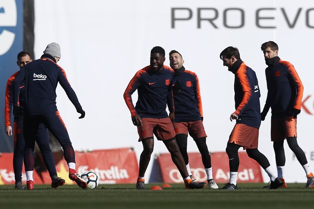 FC Barcelona's Lionel Messi, second right, takes part during a training session with his teammates at the Sports Center FC Barcelona Joan Gamper in Sant Joan Despi, Spain, Saturday, Feb. 10, 2018. FC Barcelona will play against Getafe in a Spanish La Liga soccer match on Sunday. (AP Photo/Manu Fernandez)
