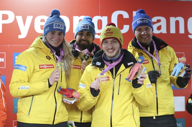 Winners of Germany from left, Natalie Geisenberger, Johannes Ludwig, Sascha Benecken, and Toni Eggert, celebrate during the medal ceremony for the team relay event of the Luge World Cup at the Alpensia Sliding Centre in Pyeongchang, South Korea, Sunday, Feb. 19, 2017. (AP Photo/Lee Jin-man)