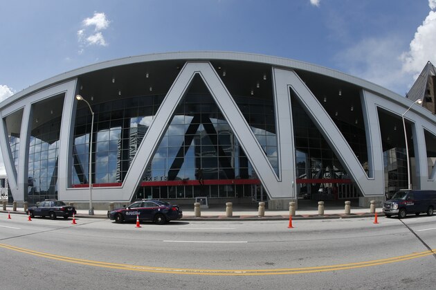 This image taken with a fisheye lense shows The Philips Arena, home of the Atlanta Hawks NBA basketball team, Thursday, July 6, 2017, in Atlanta. A former security manager at the arena says white entertainers performing there were allowed to bypass security measures while similar requests by black entertainers were denied. Alleging racial discrimination, Samuel R. Hayes III filed a federal lawsuit on Monday against Atlanta Hawks LLC, which operates the arena. The lawsuit says Hayes was fired because he's black and because he complained about security measures that he says were selectively enforced based on race. (AP Photo/John Bazemore)