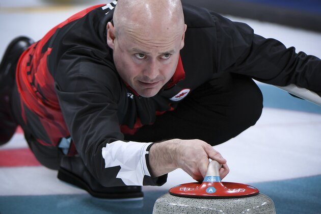 Canada's Kevin Koe throws the stone during the curling men's round robin session between Canada and Britain during the Pyeongchang 2018 Winter Olympic Games at the Gangneung Curling Centre in Gangneung on February 14, 2018. / AFP PHOTO / WANG Zhao        (Photo credit should read WANG ZHAO/AFP/Getty Images)