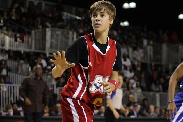 LOS ANGELES, CA - FEBRUARY 18:  Justin Bieber plays at the 2011 BBVA NBA All-Star Celebrity Game at the Los Angeles Convention Center on February 18, 2011 in Los Angeles, California.  NOTE TO USER: User expressly acknowledges and agrees that, by downloading and or using this photograph, User is consenting to the terms and conditions of the Getty Images License Agreement. (Photo by Noel Vasquez/Getty Images)
