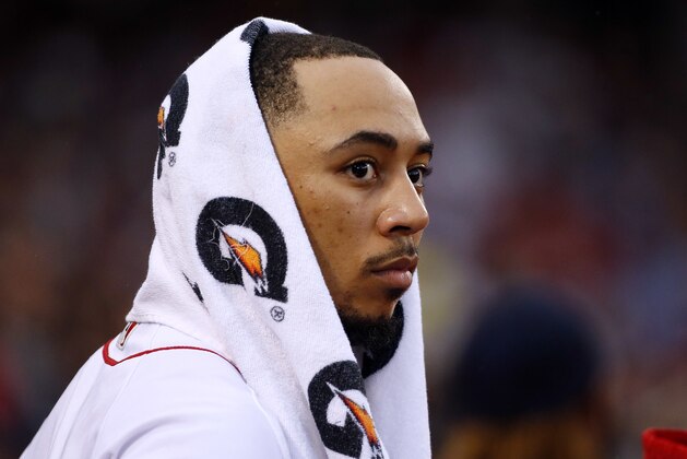 Boston Red Sox's Mookie Betts stands in the dugout during the ninth inning in Game 4 of baseball's American League Division Series against the Houston Astros, Monday, Oct. 9, 2017, in Boston. (AP Photo/Michael Dwyer)