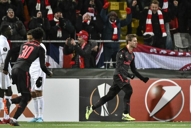 Arsenal's Nacho Monreal (R) celebrates after scoring the 0-1 during the UEFA Europa League round of 32, first leg football match of Ostersund FK vs Arsenal FC on February 15, 2018 in Ostersund, Sweden. / AFP PHOTO / TT NEWS AGENCY / Robert HENRIKSSON / Sweden OUT        (Photo credit should read ROBERT HENRIKSSON/AFP/Getty Images)