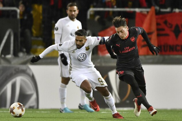 Ostersund's Saman Ghoddos (L) vies for the ball with Arsenal's Mesut Özil during the UEFA Europa League round of 32, first leg football match of Ostersund FK vs Arsenal FC on February 15, 2018 in Ostersund, Sweden. / AFP PHOTO / TT NEWS AGENCY / Robert HENRIKSSON / Sweden OUT        (Photo credit should read ROBERT HENRIKSSON/AFP/Getty Images)
