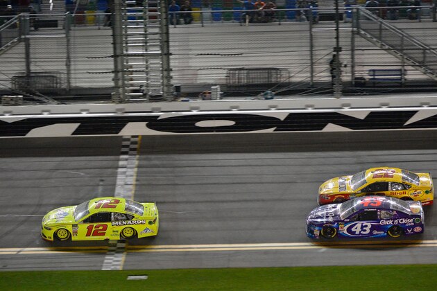 DAYTONA BEACH, FL - FEBRUARY 15:  Ryan Blaney, driver of the #12 Menards/Peak Ford, takes the checkered flag to win the Monster Energy NASCAR Cup Series Can-Am Duel 1 at Daytona International Speedway on February 15, 2018 in Daytona Beach, Florida.  (Photo by Robert Laberge/Getty Images)