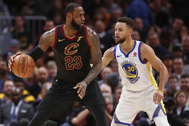 CLEVELAND, OH - JANUARY 15: LeBron James #23 of the Cleveland Cavaliers dribbles the ball against Stephen Curry #30 of the Golden State Warriors at Quicken Loans Arena on January 15, 2018 in Cleveland, Ohio. NOTE TO USER: User expressly acknowledges and agrees that, by downloading and or using this photograph, User is consenting to the terms and conditions of the Getty Images License Agreement.(Photo by Michael Hickey/Getty Images)
