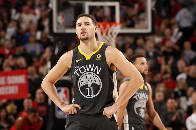 PORTLAND, OR - FEBRUARY 14: Klay Thompson #11 of the Golden State Warriors looks on during the game against the Portland Trail Blazers on February 14, 2018 at the Moda Center in Portland, Oregon. NOTE TO USER: User expressly acknowledges and agrees that, by downloading and or using this Photograph, user is consenting to the terms and conditions of the Getty Images License Agreement. Mandatory Copyright Notice: Copyright 2018 NBAE (Photo by Cameron Browne/NBAE via Getty Images)
