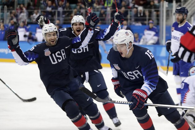 Ryan Donato (16), of the United States, celebrates after scoring a goal against Slovakia during the first period of the preliminary round of the men's hockey game at the 2018 Winter Olympics in Gangneung, South Korea, Friday, Feb. 16, 2018. (AP Photo/Julio Cortez)