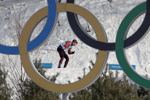 Dario Cologna, of Switzerland, competes during the men's 15km freestyle cross-country skiing competition at the 2018 Winter Olympics in Pyeongchang, South Korea, Friday, Feb. 16, 2018. (AP Photo/Dmitri Lovetsky)