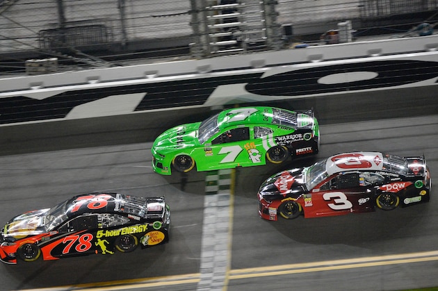 DAYTONA BEACH, FL - FEBRUARY 15:  Martin Truex Jr., driver of the #78 Bass Pro Shops/5-hour Energy Toyota, races Danica Patrick, driver of the #7 GoDaddy Chevrolet, and Austin Dillon, driver of the #3 DOW Chevrolet, during the Monster Energy NASCAR Cup Series Can-Am Duel 2 at Daytona International Speedway on February 15, 2018 in Daytona Beach, Florida.  (Photo by Robert Laberge/Getty Images)