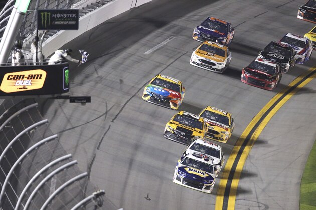 Chase Elliott, bottom right, takes the checkered flag to win the second of two qualifying races for the NASCAR Daytona 500 auto race at Daytona International Speedway in Daytona Beach, Fla., Thursday, Feb. 15, 2018. (AP Photo/David Graham)