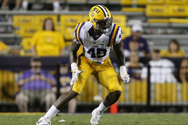 BATON ROUGE, LA - SEPTEMBER 10:  Arden Key #49 of the LSU Tigers defends during a game at Tiger Stadium on September 10, 2016 in Baton Rouge, Louisiana.  (Photo by Jonathan Bachman/Getty Images)