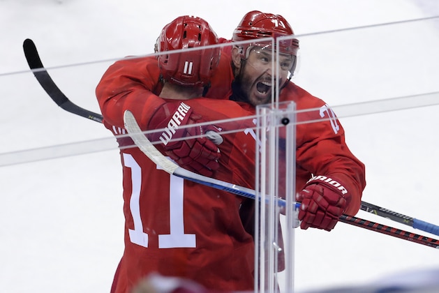 Russian athlete Ilya Kovalchuk (71) celebrates with Sergei Andronov (11) after scoring a goal during the second period of the preliminary round of the men's hockey game at the 2018 Winter Olympics in Gangneung, South Korea, Saturday, Feb. 17, 2018. (AP Photo/Julio Cortez)